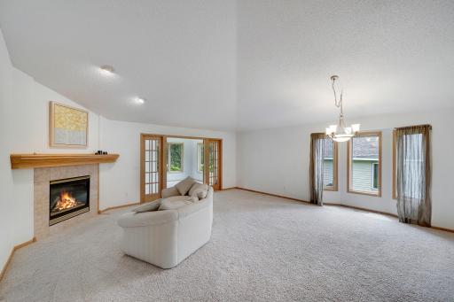 A gas fireplace provides warmth and ambiance while bayed window combination brings in light from the south.