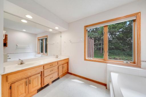 Large primary bath has a double sink, soaking tub and seperate shower.