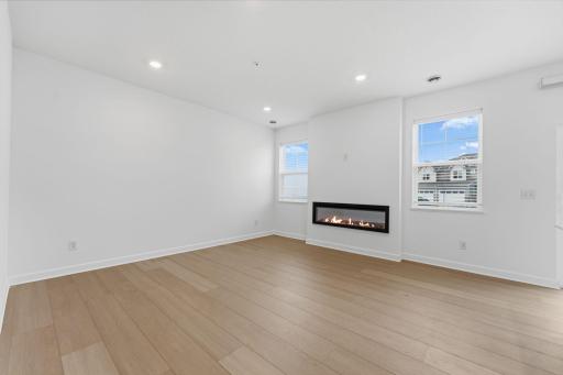 The natural gathering space of the home, the Great Room is excellent for hosting movie nights with loved ones, daily recreational activities and seamless relaxation, with an electric fireplace to add a warm charm.