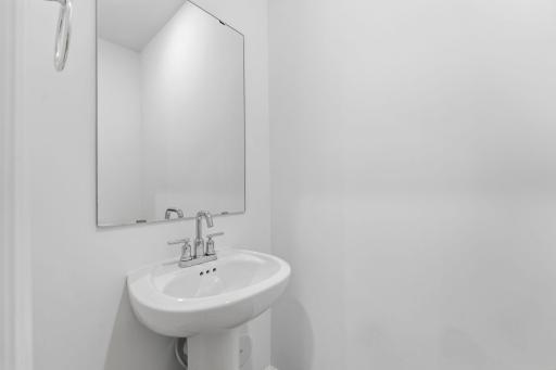 In a discreet location on the first floor is a convenient powder room to accommodate the needs of the whole household and visiting guests.