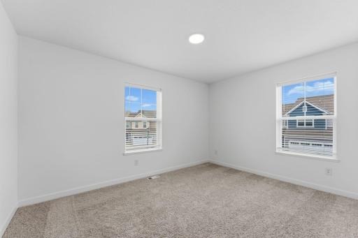 The two secondary bedrooms can be found on the top level to provide a quiet haven away from the bustling downstairs main living area.