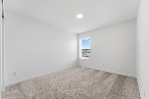 All bedrooms in the home include plush wall-to-wall carpeting and practical wardrobe closets