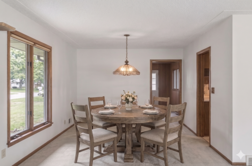 Main level: dining room (virtually staged)