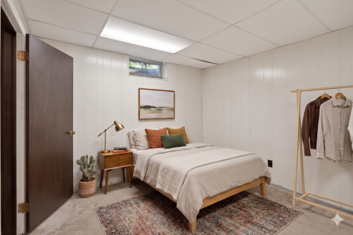 Lower level: bedroom 5 (non-conforming) virtually staged
