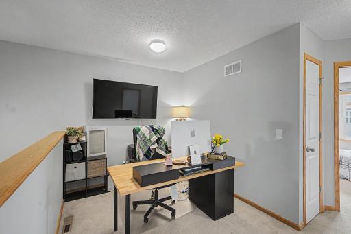 Upper level loft is currently used as an office