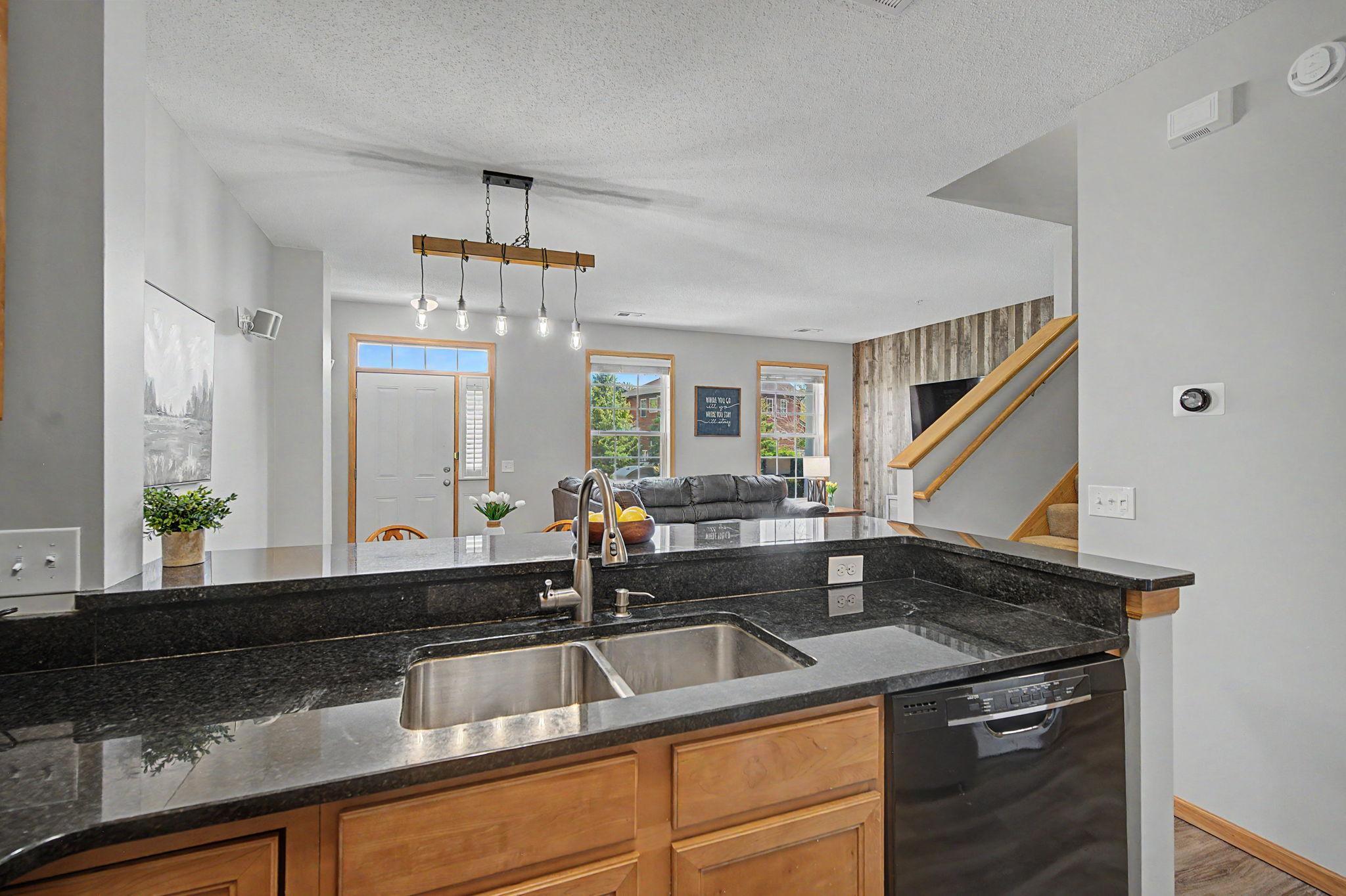 View from kitchen overlooking the dining room and living room
