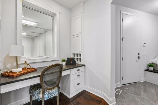 Back entry view as you enter from heated/finished garage. Convenient desk nook to pay bills, ideal space for kids to study while you're working in the kitchen or simply work from home while watching the crew in your indoor sport court below.