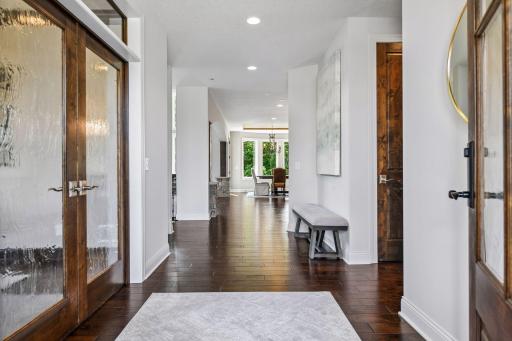 Welcome to your new home at 9690 Sky Lane! View as you enter through the front door. ML office with French doors on the left along with entry on the right side to the back hall cubbies and bath.