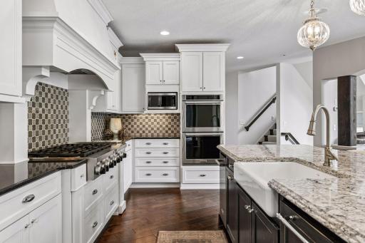 Custom pull outs in kitchen provide tons of storage. Beverage refrigerator plus full refrigerator to handle all your beverage and entertaining needs.