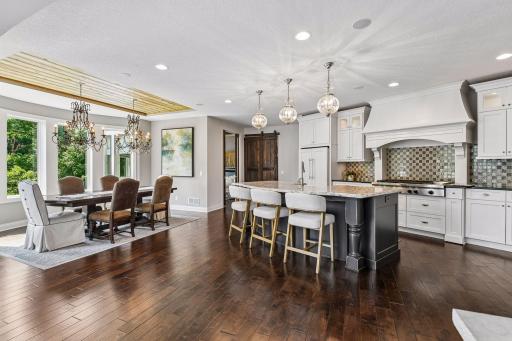Formal or informal dining spaces offer flexibility along with counter- top seating. Home has inlay speakers for music and audio rack in utility room.