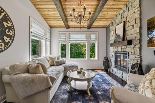 Sunroom office kitchen is an ideal spot to relax, read a book or cozy up to the gas fireplace. Year-round enjoyment for all in this space.