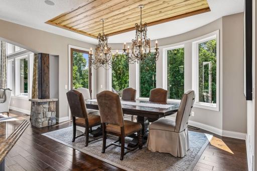 Custom lighting throughout home complimented by Knotty Alder pillars which accent main level living room.