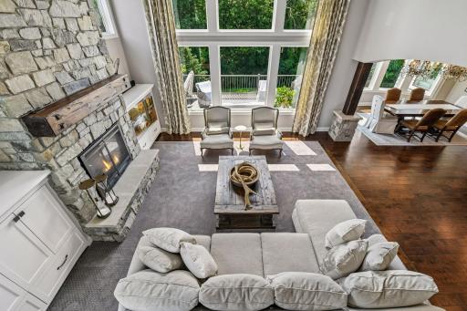 View from upper staircase to private tree lined yard and decking.