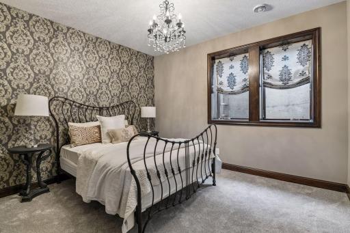 5th lower-level bedroom with spacious closet. All closets have custom shelves and built-in throughout the home.