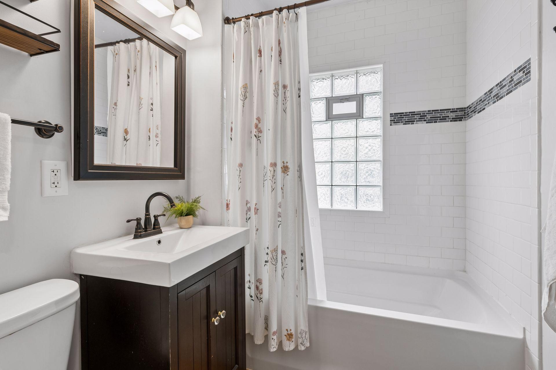 Main level bathroom with classic subway tile!