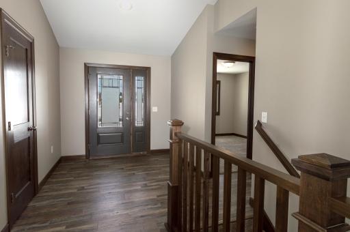 Gorgeous front entry doors come standard in this new construction dream home!