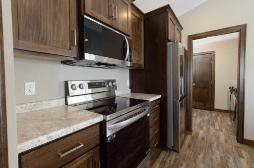 Main Floor Laundry Conveniently Located Near Garage Service Just beyond the kitchen.jpg