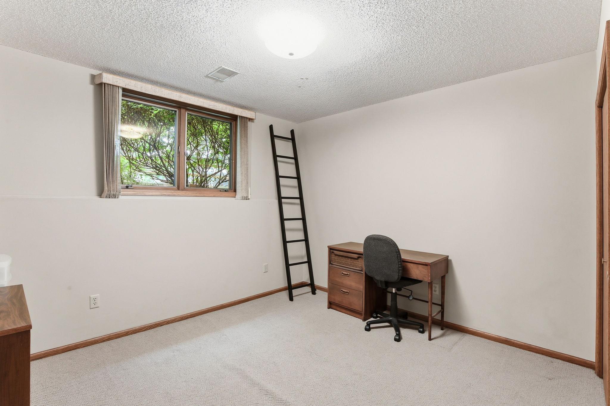 Bedroom 4 with a look out window