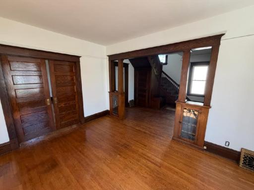 Gorgeous leaded glass built-ins, pocket doors and hardwood floors.
