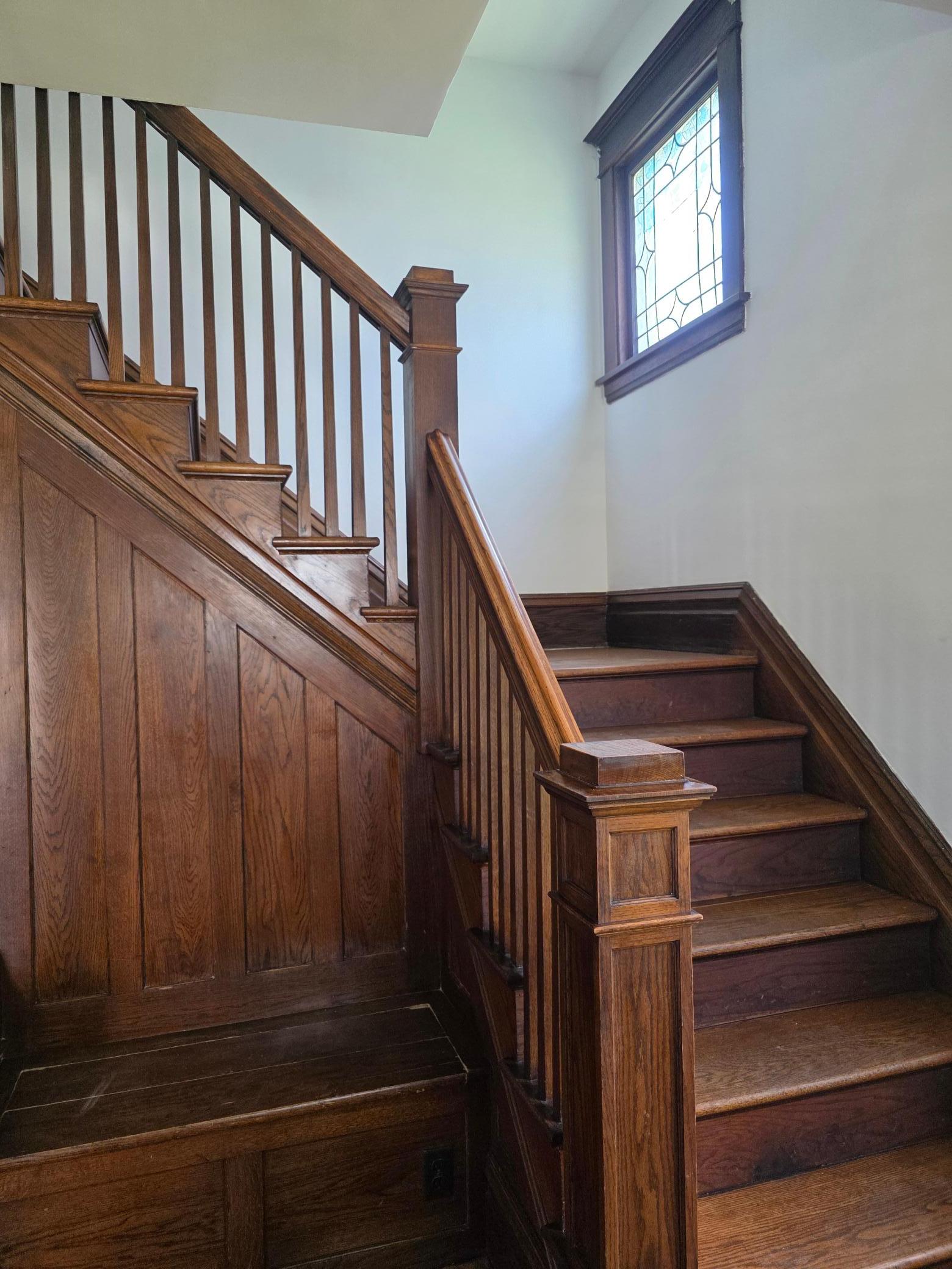 Love this beautiful open staircase with built-in bench.