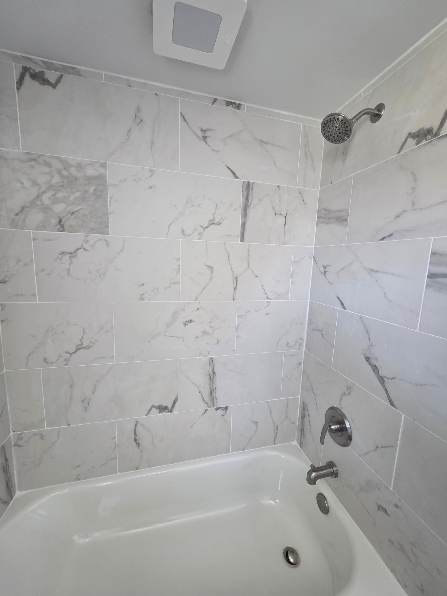 Beautiful tiled tub/shower.