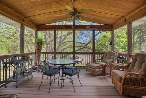 Enjoy the sounds of birds chipping and scenic views on this lovely three-season porch.