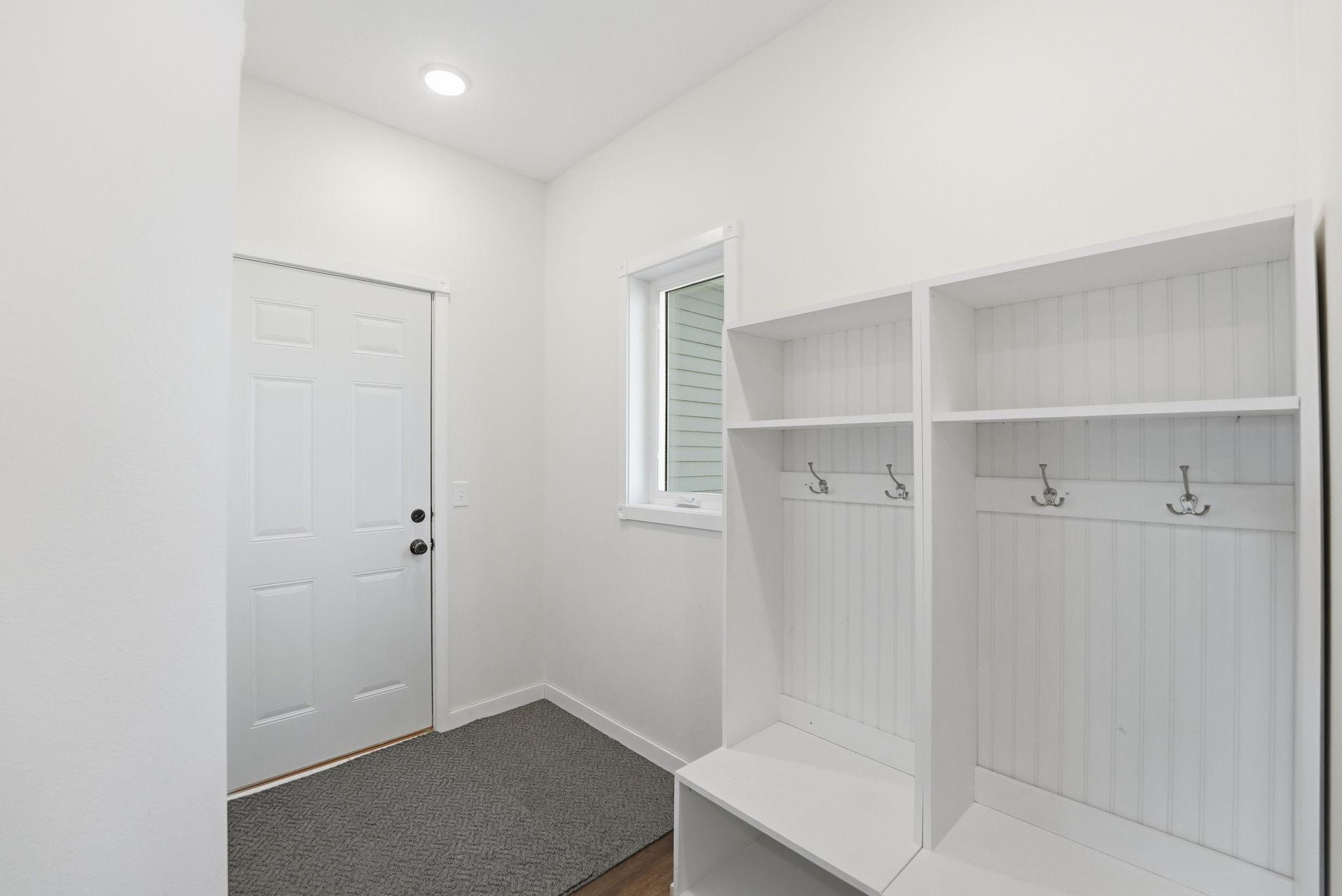 Spacious mudroom with built in lockers for outdoor apparel.