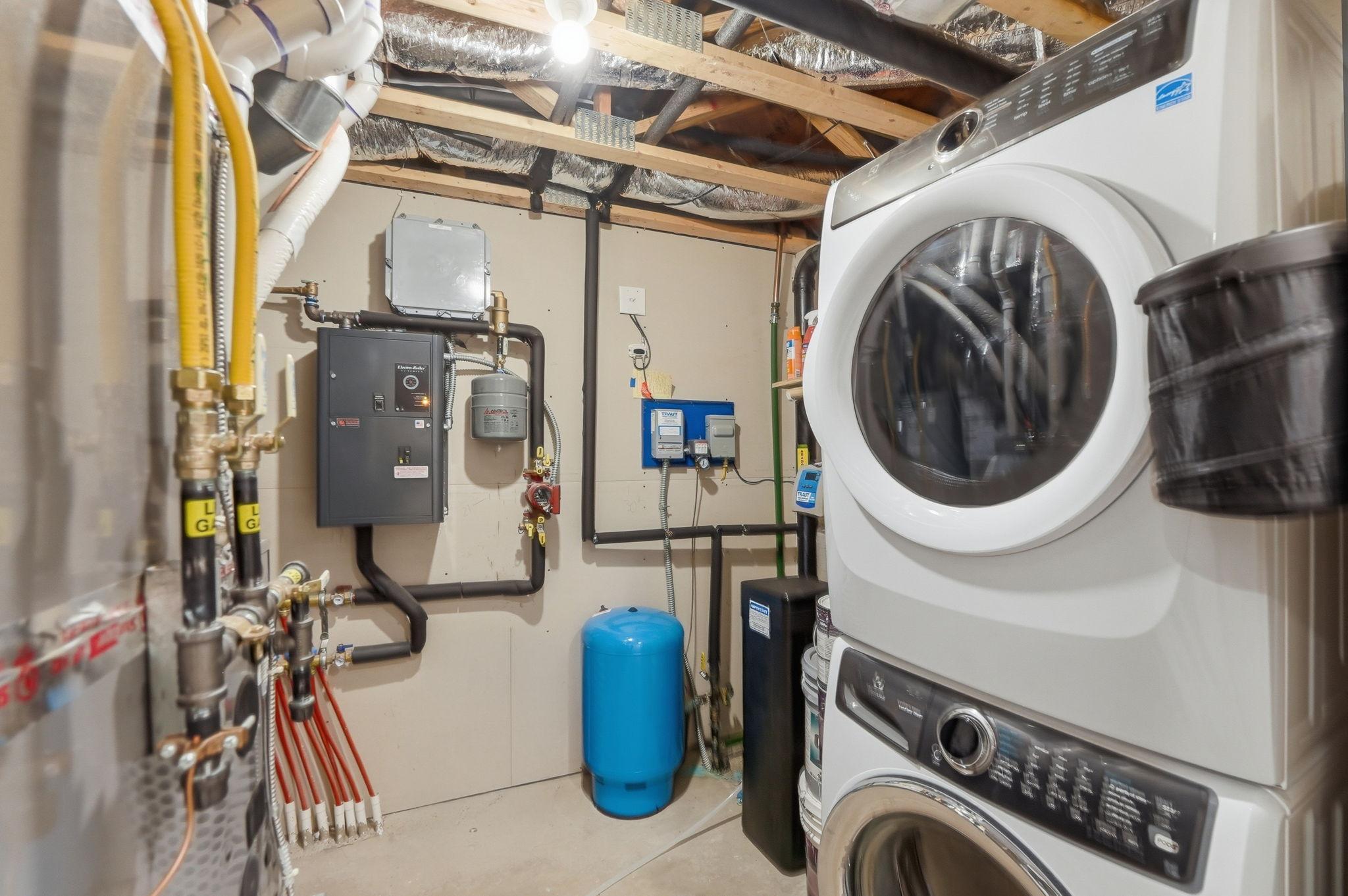 Lower level laundry doubles as a mechanical room.