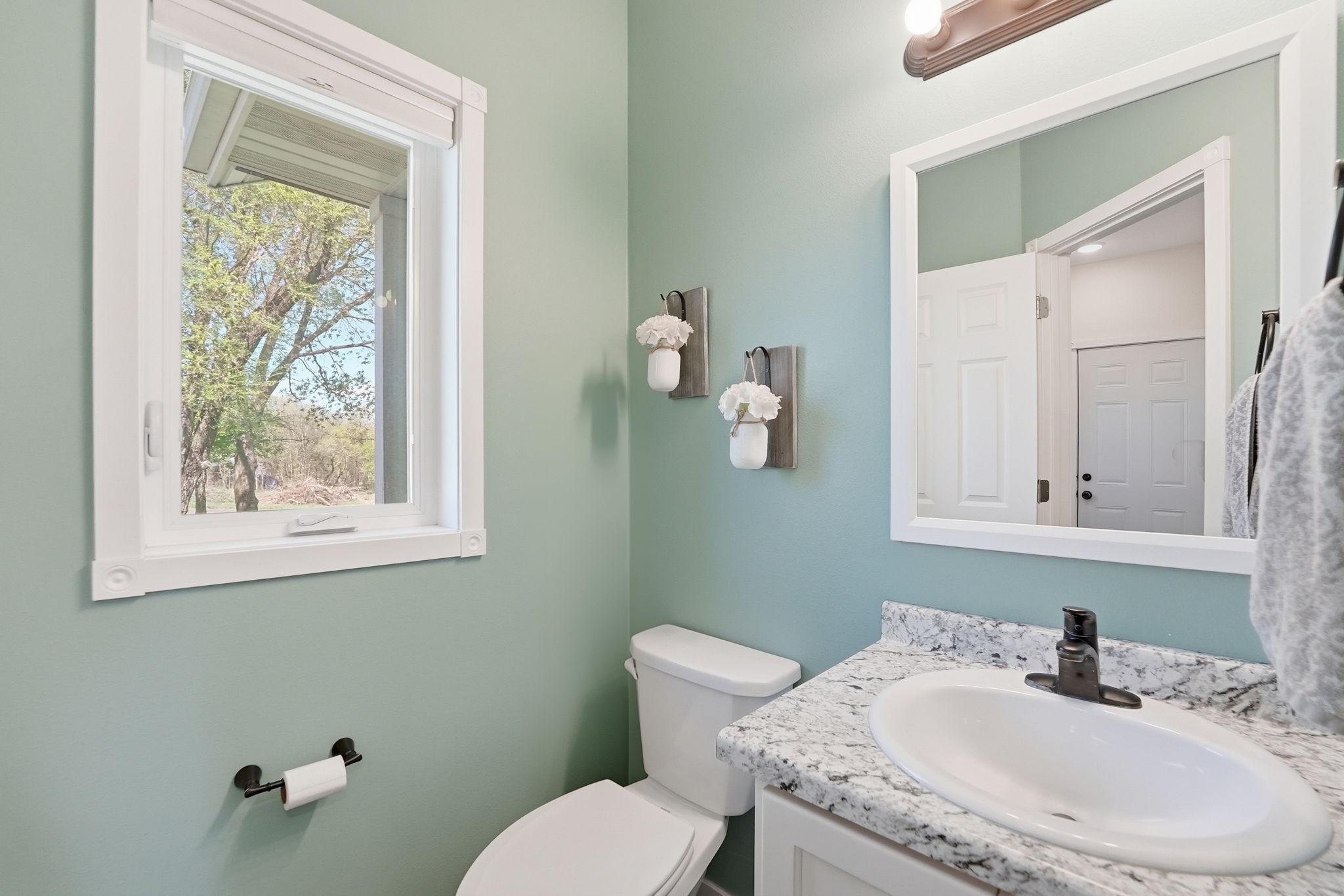 Convenient half bath for guests.