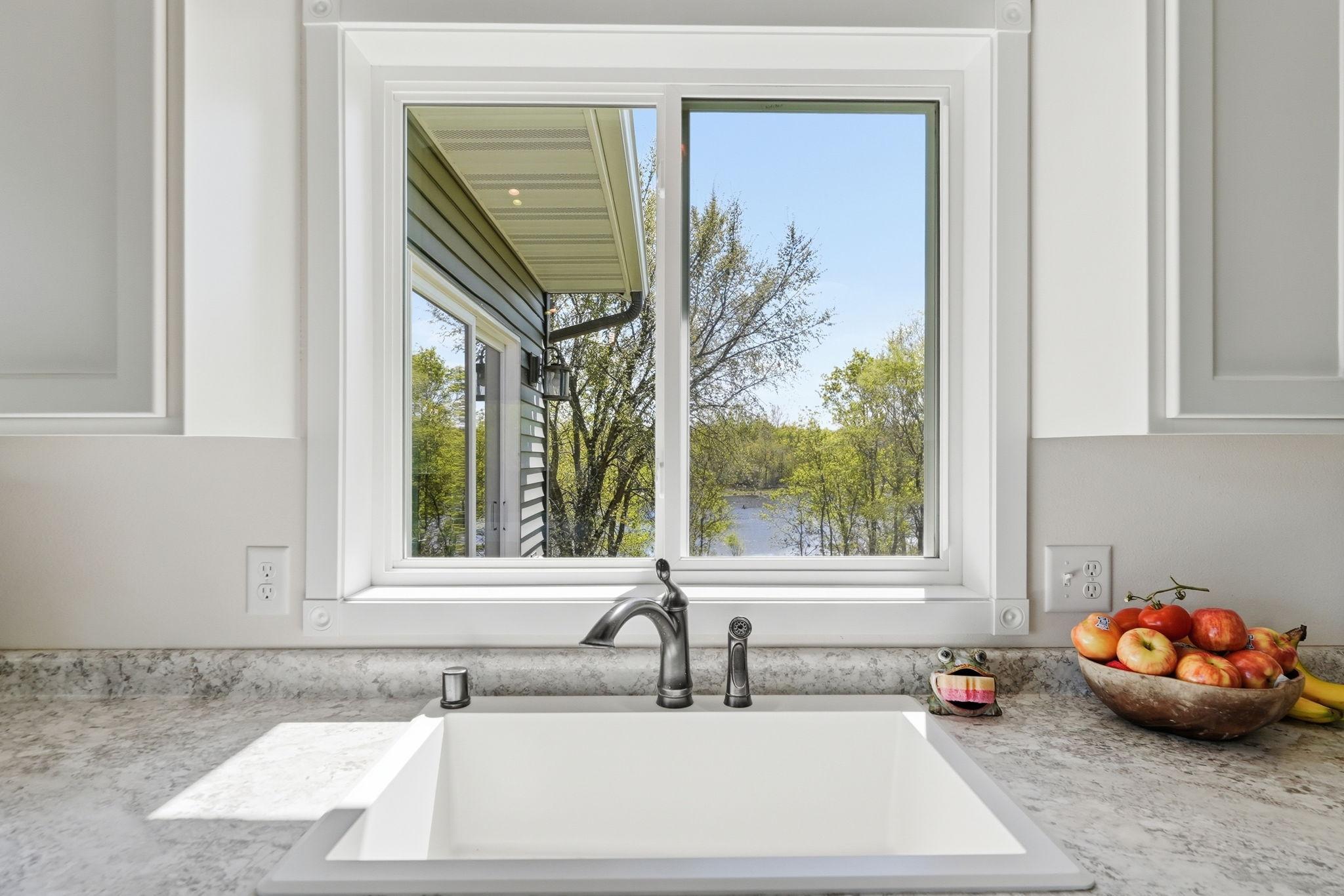 Kitchen window looks out to your backyard oasis.