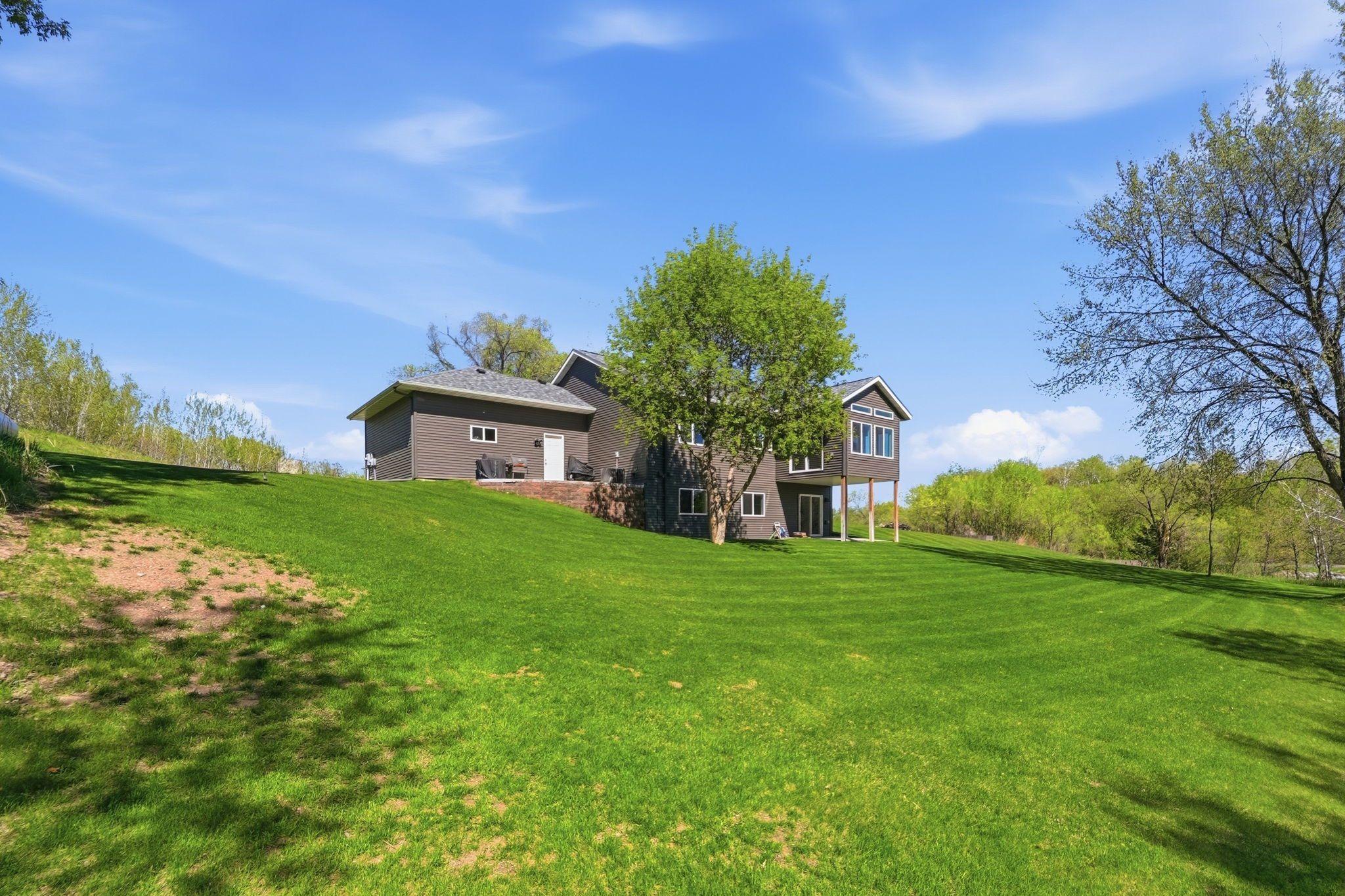 Lush greenery surrounds the home.