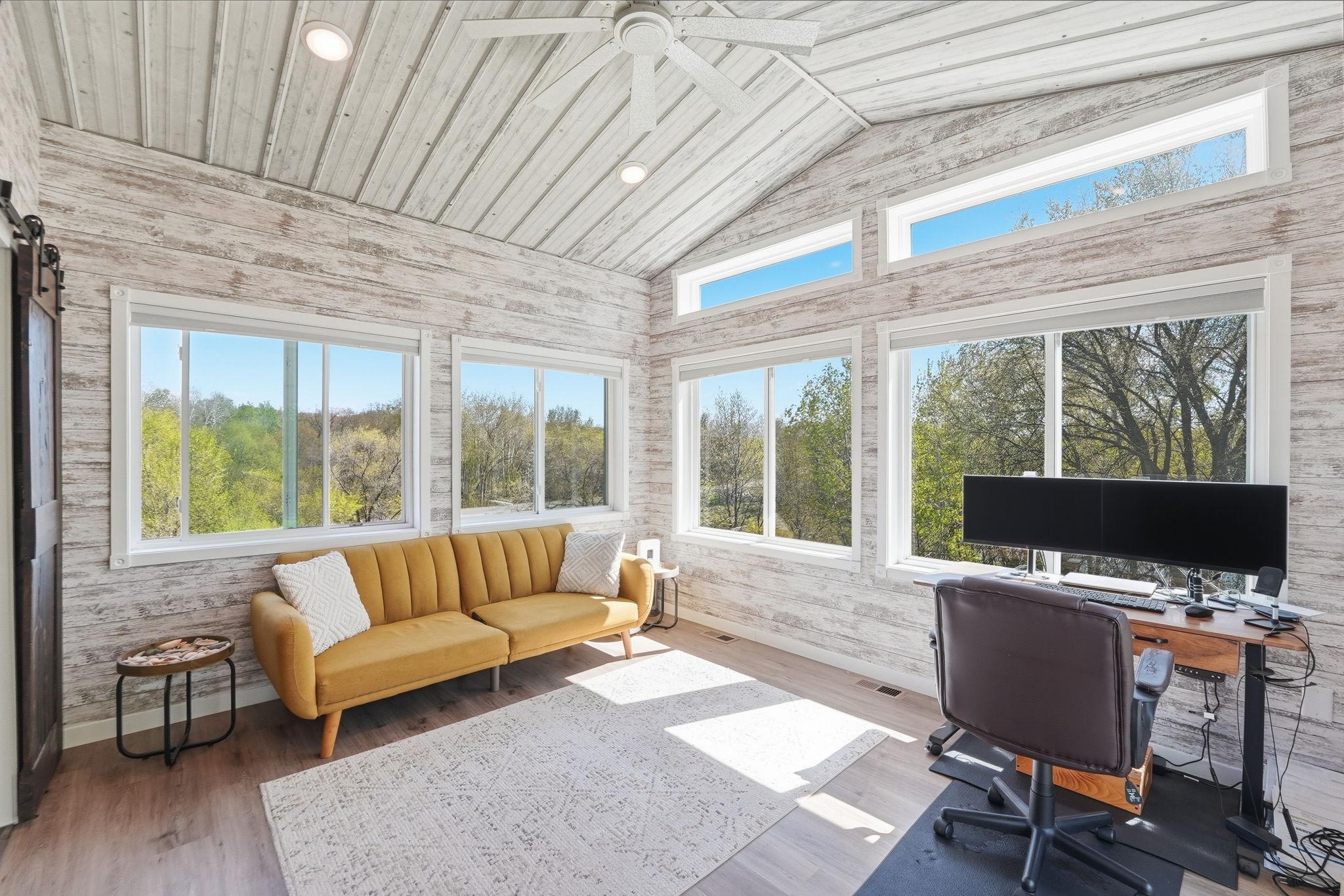 Bright sunroom offers a comfortable space to enjoy natural light year-round.