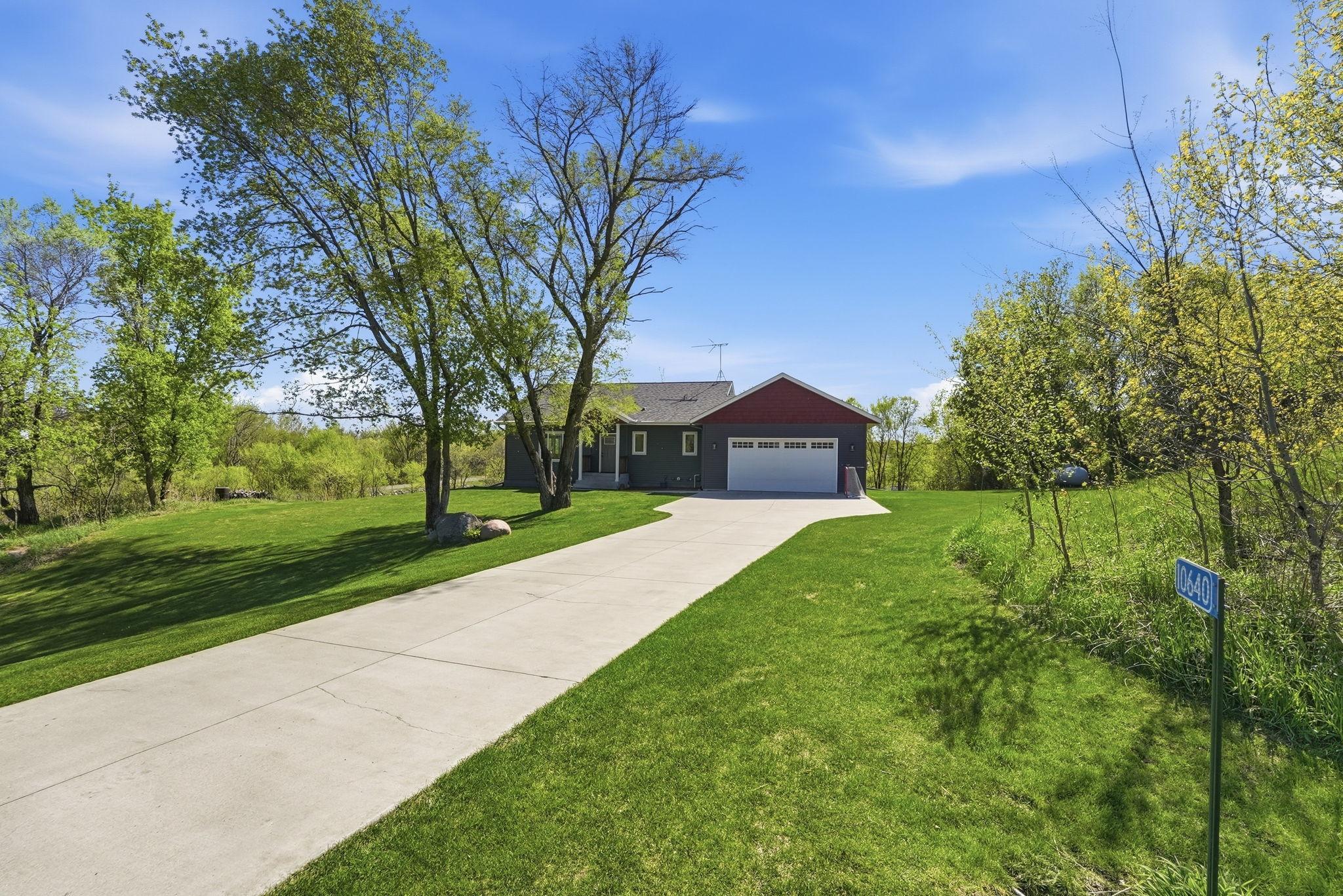 Driveway space accommodates multiple vehicles.