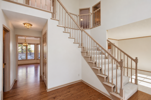 Grand foyer (Virtually staged & enhanced) demonstrating it will without wall covering
