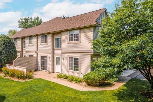Enjoy a peaceful setting with expansive green space, mature trees, and a private patio perfect for relaxing or entertaining.
