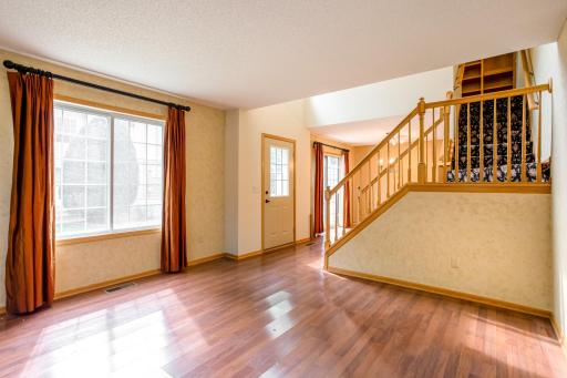 Open and welcoming main living area showcases a functional layout with soaring ceilings, abundant sunlight, and easy flow throughout.