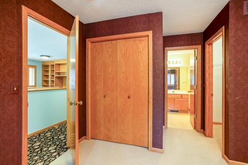 Comfortable primary suite with a walk-in closet and convenient access to the walk-thru primary bath.