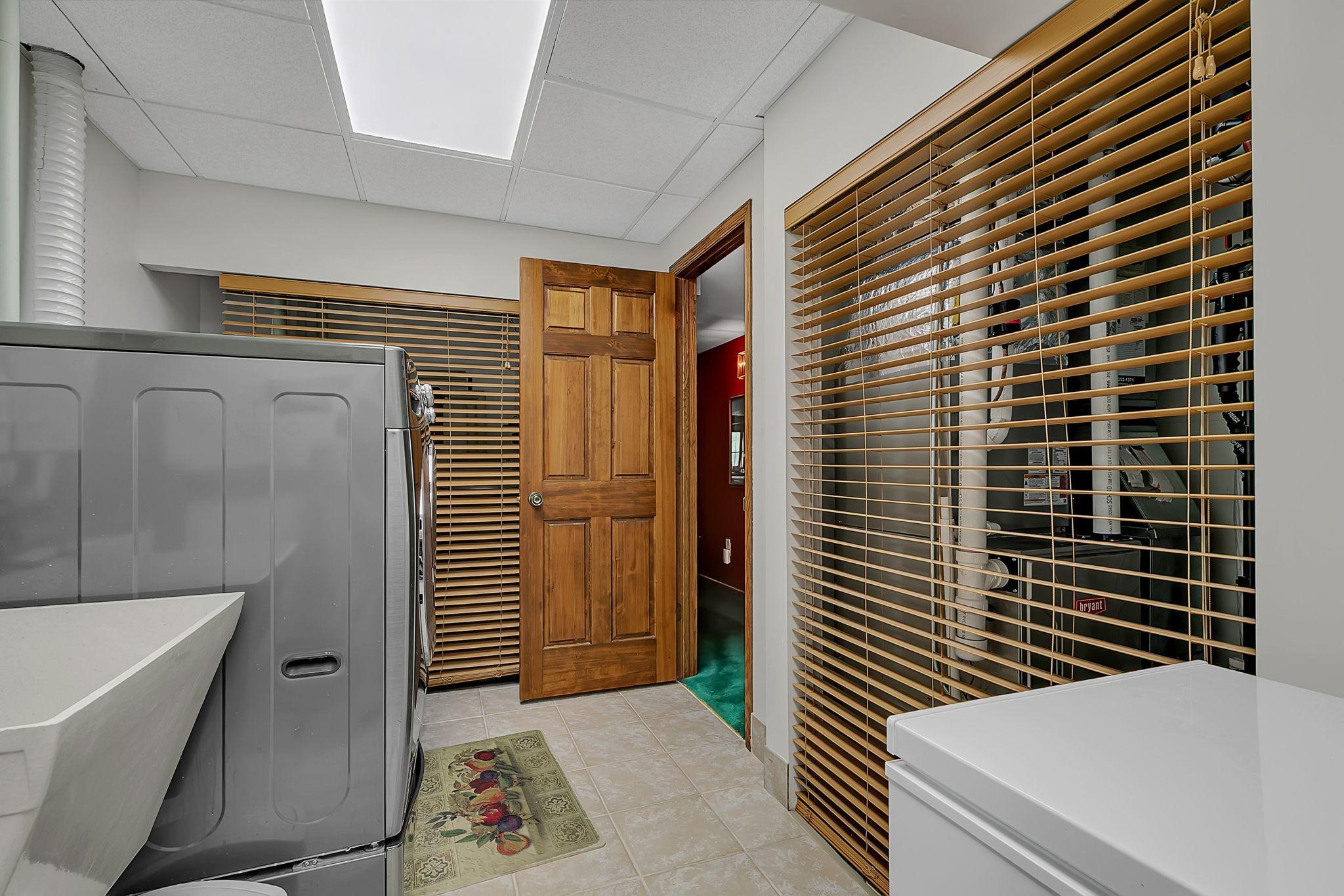 Features a utility sink.