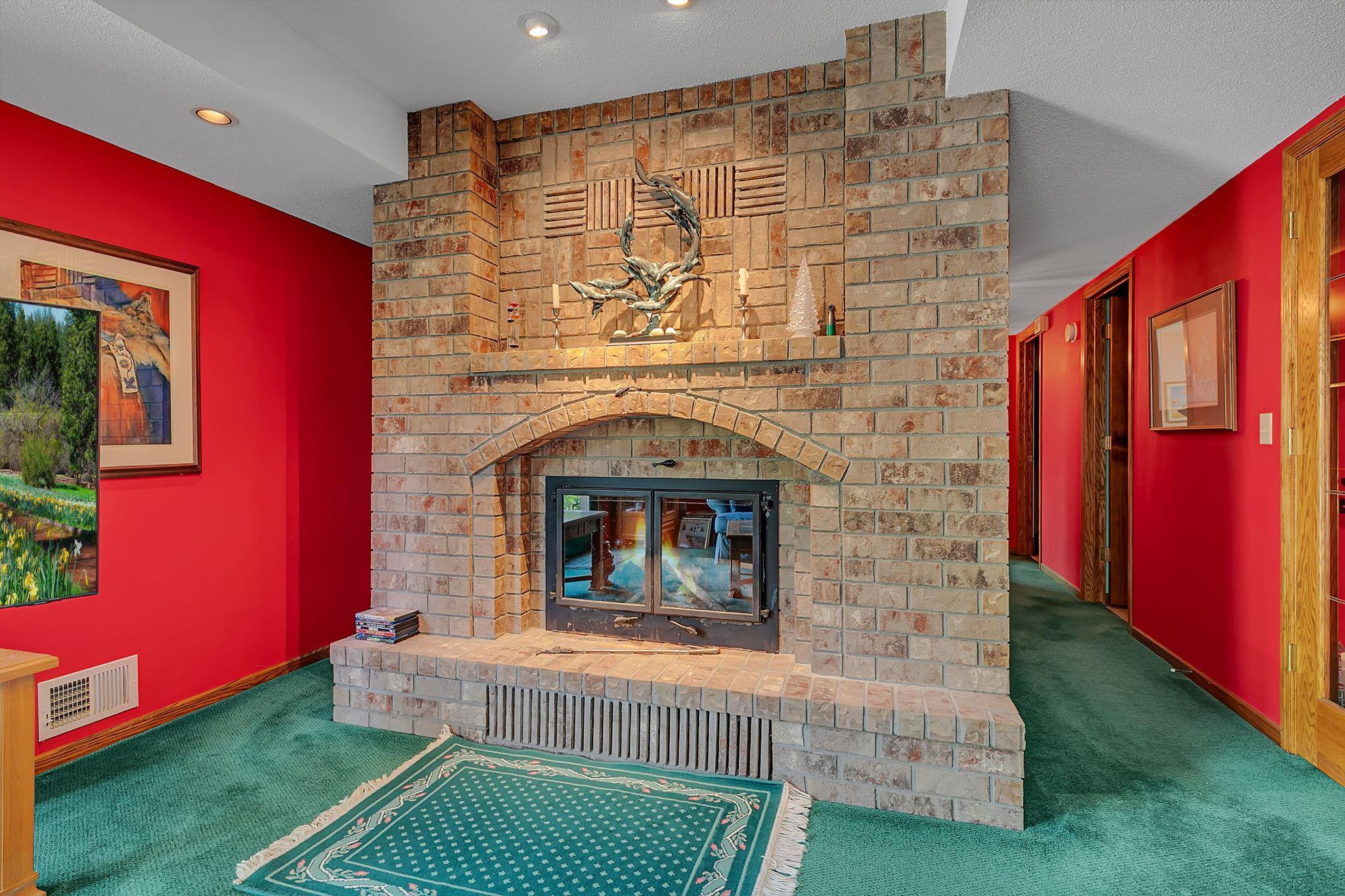 Bricked in fireplace becomes a focal point of this space.