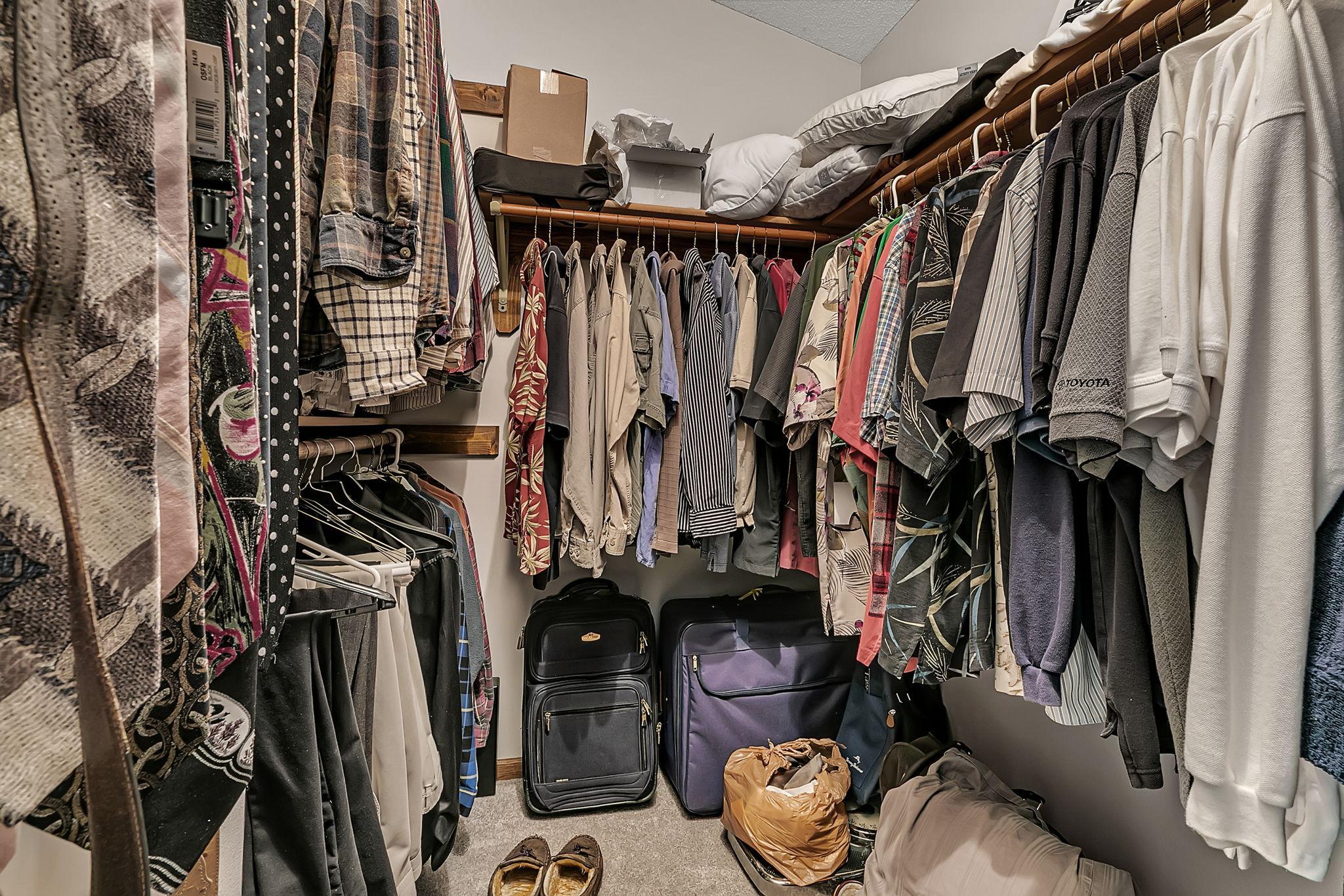 Generously sized walk in closet.