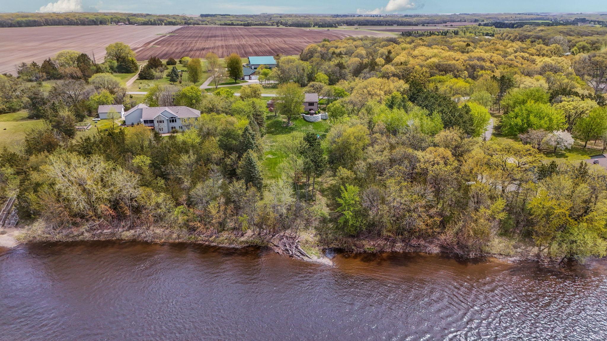 Aerial perspective emphasizes the home’s scenic and serene environment.