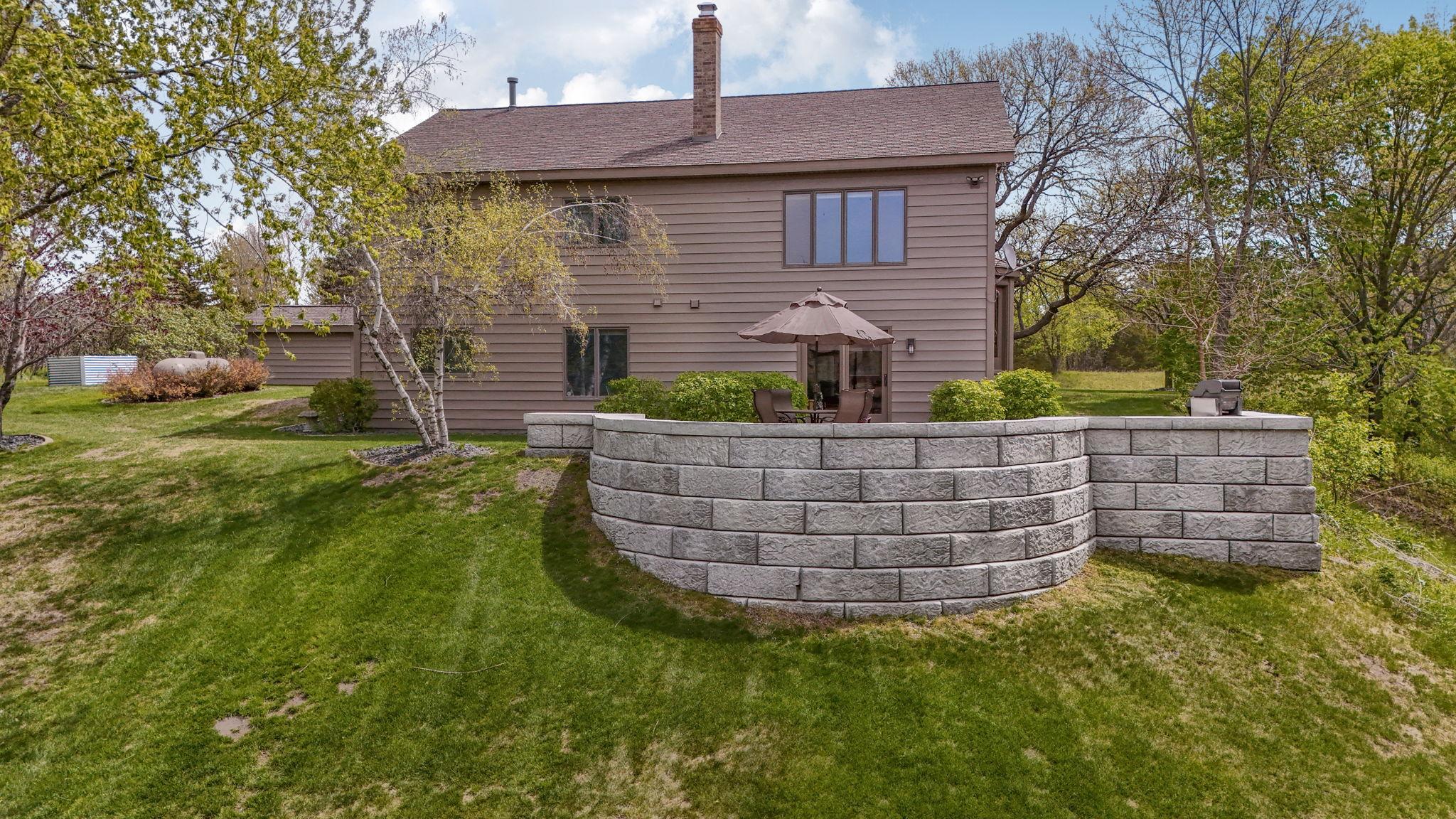 Well-maintained landscaping enhances the home’s curb appeal.