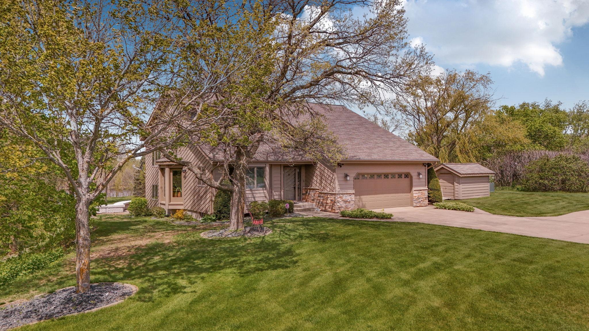 Mature trees shade the lot during the summer months.