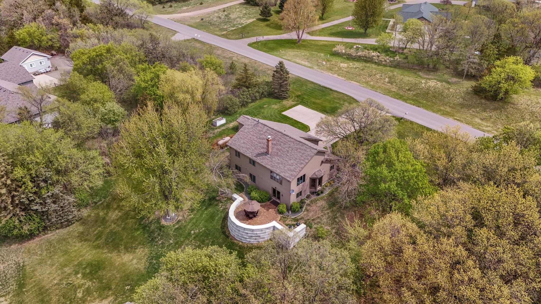 Aerial drone views showcase the property’s layout and surroundings.