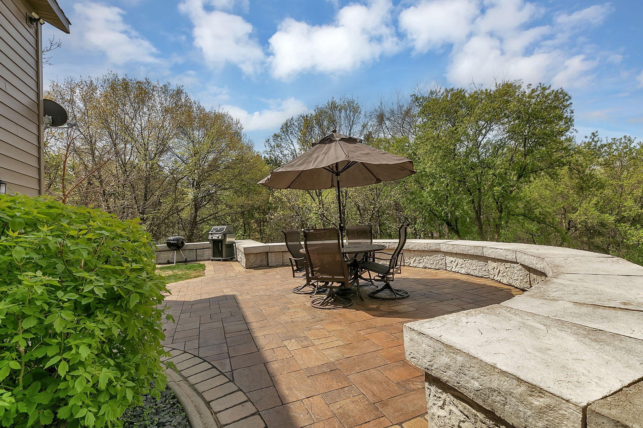 Back exterior features ideal spaces for relaxing, dining, and gathering outdoors.