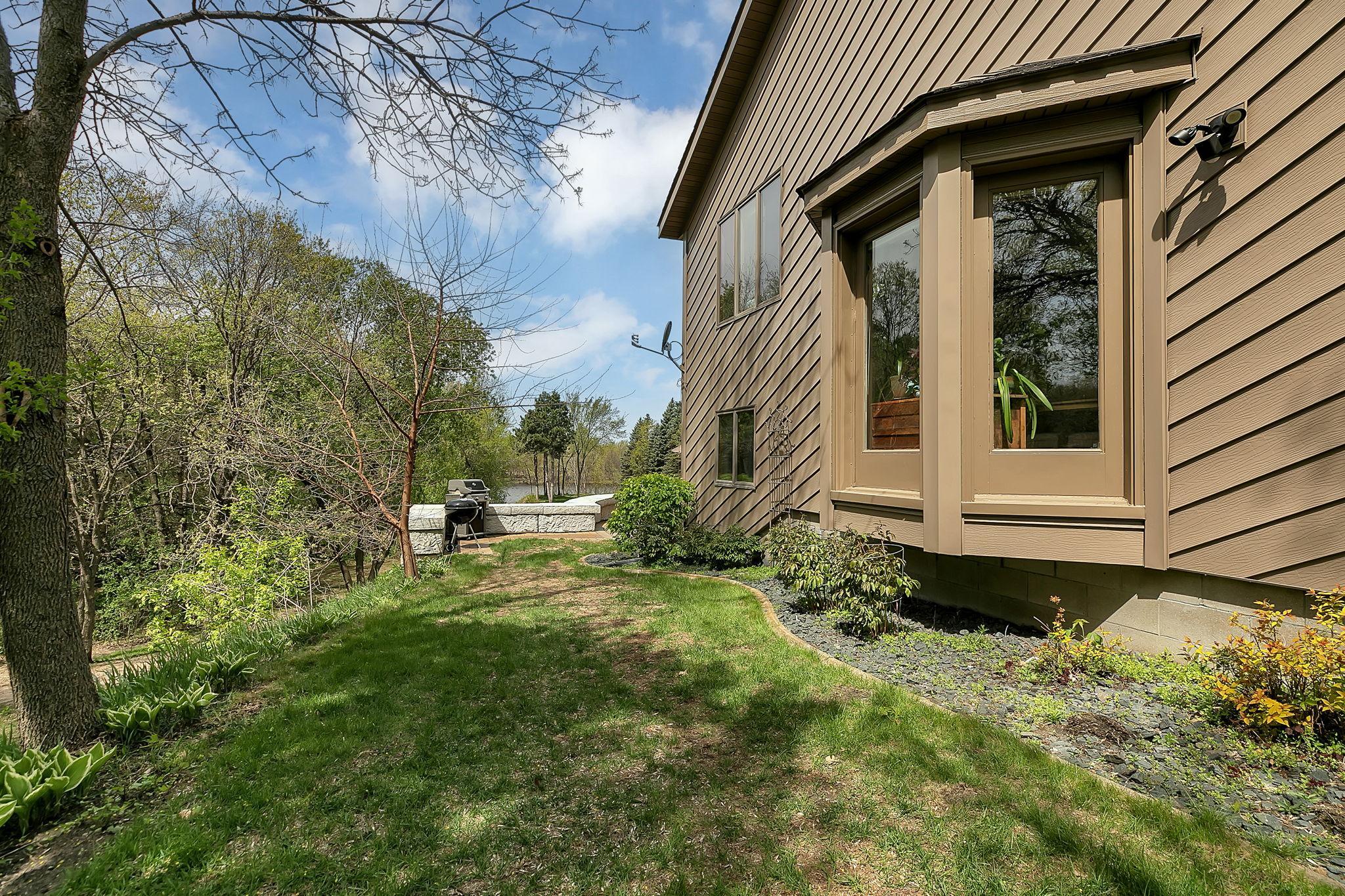 Lush landscaping blends seamlessly with the natural surroundings.