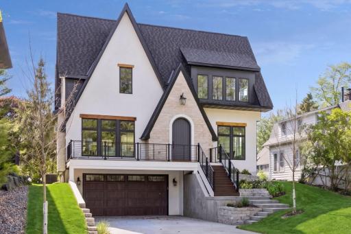 Stucco + Custom Stone + Cedar Accets + Trex Decking & Railing