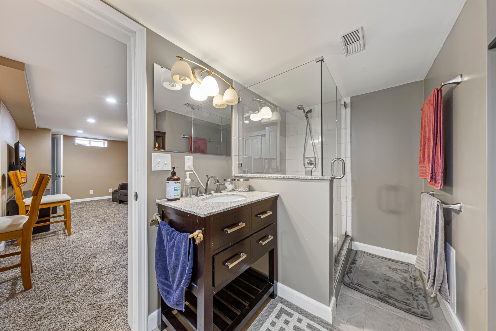Updated lower level bathroom with walk-in shower.