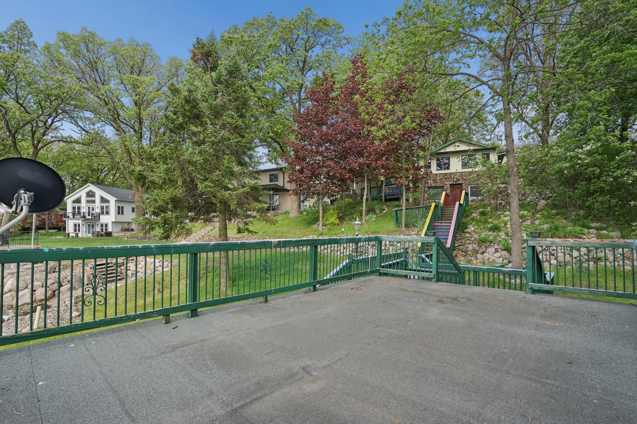 Looking back, you can see the home. Choose to keep privacy intact by leaving the trees, or choose to increase the lake view by trimming them some.