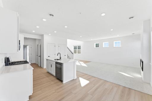 (Photo of a similar home, actual finishes may vary) The dining room enjoys direct access to the patio for seamless indoor-outdoor parties